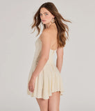 The Sweet Allure Strapless Drop Waist Skater Romper is a trendy women's bottom in natural, designed with modern details and alluring textures to complete chic outfits for 2025.