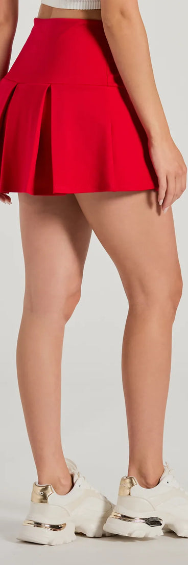 The Pleated Perfection High-Rise Ponte Skort is a trendy women's bottom in red, designed with modern details and alluring textures to complete chic outfits for 2025.