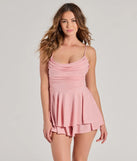 The All That Glitters Cowl Neck Skater Romper is a shimmery pink glitter dress that catches the light beautifully, perfect for any special outfit like Winter Formal attire, clubwear, or a wedding guest dress.
