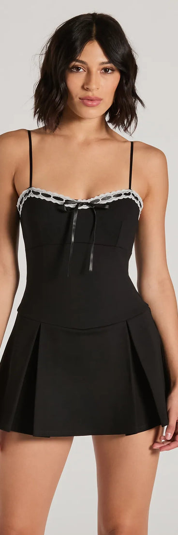 Perfect as a dress alternative for a New Year's outfit, wedding guest attire, and cocktail party dress alike, the Classy Yet Sassy Lace Trim Pleat Ponte Skater Romper is a women's black romper that combines a stylish, unique design with festive colors and holiday-ready details for a standout look!