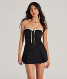 Perfect as a dress alternative for a date-night outfit, wedding guest attire, and cocktail party dress alike, the Cute Charm Strapless Ruffled Bow-Front Skater Romper is a women's black romper that combines a stylish, unique design with festive colors and on-trend details for a standout look!