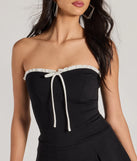 Perfect as a dress alternative for a date-night outfit, wedding guest attire, and cocktail party dress alike, the Cute Charm Strapless Ruffled Bow-Front Skater Romper is a women's black romper that combines a stylish, unique design with festive colors and on-trend details for a standout look!