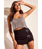 The Exceptionally Precious Rhinestone Bow Ponte Skort is a trendy women's bottom, designed with modern details and alluring textures to complete chic outfits for 2025.