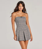 Perfect as a dress alternative for a date-night outfit, wedding guest attire, and cocktail party dress alike, the Sweet Perception Strapless Plaid Pleated Romper is a women's gray romper that combines a stylish, unique design with festive colors and on-trend details for a standout look!