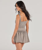 The Charming Direction Sleeveless Plaid Romper is a trendy women's bottom in taupe, designed with modern details and alluring textures to complete chic outfits for 2025.
