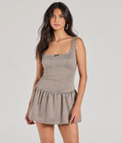 The Charming Direction Sleeveless Plaid Romper is a trendy women's bottom in taupe, designed with modern details and alluring textures to complete chic outfits for 2025.