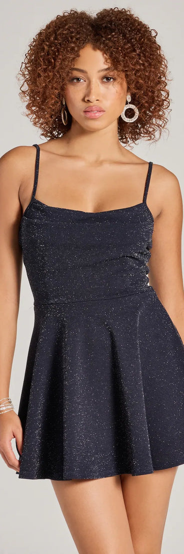 Revamp your 2025 wardrobe with this chic addition, the Take Me Dancing Cowl Neck Skater Glitter Romper in navy, perfect for elevating your style in the new year.