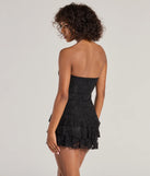 The Simply Adorable Ruffled Drop Waist Lace Romper is a trendy women's bottom in black, designed with modern details and alluring textures to complete chic outfits for 2025.