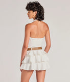 The Trendy Slay Ruffled Drop Waist Romper is a trendy women's bottom in ivory, designed with modern details and alluring textures to complete chic outfits for 2025.