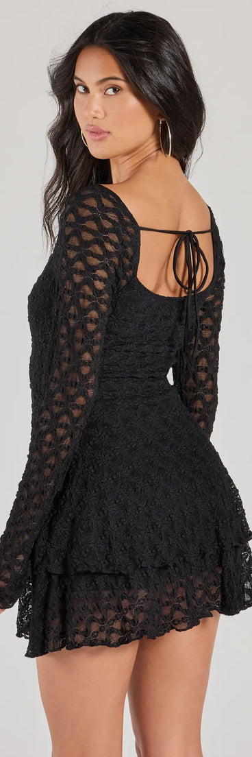 The Feel The Romance Long Sleeve Lace Skater Romper is a trendy women's bottom in black, designed with modern details and alluring textures to complete chic outfits for 2025.