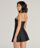 The Chicest Look Pinstripe Pleated Drop Waist Romper is a trendy women's bottom in black, designed with modern details and alluring textures to complete chic outfits for 2025.