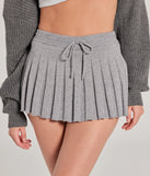 Get the look of a skirt and the comfort of shorts in the Pleated Charm High Waist Skort in charcoal, perfect for staying stylish while on the move this summer.