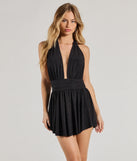 Perfect as a dress alternative for a date-night outfit, wedding guest attire, and cocktail party dress alike, the Sultry Sparkle Glitter Knit Plunging Halter Romper is a women's black romper that combines a stylish, unique design with festive colors and on-trend details for a standout look!