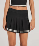 Create bold, fashion-forward looks for spring or summer with the Preppy Please Striped Pleated Knit Skort in black, a must-have piece from Windsor’s collection of stylish bottoms for women.
