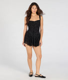 The Flirty Instinct Flocked Floral Velvet Ruffle Romper in black brings edge and energy to your vibe, ready to elevate any festival look or concert outfit.