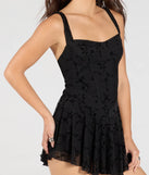 Create bold, fashion-forward looks for spring or summer with the Flirty Instinct Flocked Floral Velvet Ruffle Romper in black, a must-have piece from Windsor’s collection of stylish bottoms for women.