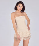 With its easy fit and flirty cut, the Simply Adorable Ruffled Drop Waist Lace Romper is a ivory one-piece that brings fun, freedom, and movement to your weekend look.