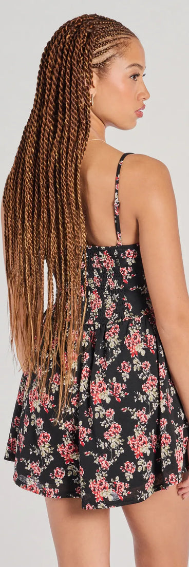 The Thriving Allure Sweetheart Floral Romper in black brings sleek style to any graduation outfit, from cap and gown to after-party.