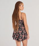 The Thriving Allure Sweetheart Floral Romper in black brings sleek style to any graduation outfit, from cap and gown to after-party.
