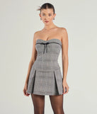 The Adorable Factor Plaid Strapless Drop Waist Romper is a trendy women's bottom in black, designed with modern details and alluring textures to complete chic outfits for 2025.