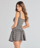The Perfect In Plaid Drop Waist A-Line Romper is a trendy women's bottom in charcoal, designed with modern details and alluring textures to complete chic outfits for 2025.