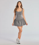 Create bold, fashion-forward looks for summer with the Perfect In Plaid Drop Waist A-Line Romper in charcoal, a must-have piece from Windsor’s collection of stylish bottoms for women.