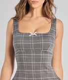 The Perfect In Plaid Drop Waist A-Line Romper is a trendy women's bottom in charcoal, designed with modern details and alluring textures to complete chic outfits for 2025.