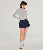 The Keeping It Cute Pleated Ponte Skort is a trendy women's bottom in navy blue, designed with modern details and alluring textures to complete chic outfits for 2025.