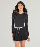 The Flirty Sport High-Rise Pleated Mini Skort is a trendy women's bottom in black, designed with modern details and alluring textures to complete chic outfits for 2025.