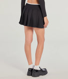 The Flirty Sport High-Rise Pleated Mini Skort is a trendy women's bottom in black, designed with modern details and alluring textures to complete chic outfits for 2025.
