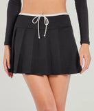 Create bold, fashion-forward looks for spring or summer with the Flirty Sport High-Rise Pleated Mini Skort in black, a must-have piece from Windsor’s collection of stylish bottoms for women.