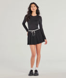 The Flirty Sport High-Rise Pleated Mini Skort is a trendy women's bottom in black, designed with modern details and alluring textures to complete chic outfits for 2025.