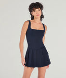 Flirty Girlie Bow Pleated Skirt Romper, a trendy navy blue mini dress featuring modern details and a fresh seasonal hue, perfect for creating chic 2025 looks.