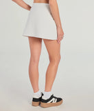 The Admirable Style High-Rise Ponte Mini Skort is a trendy women's bottom in ivory, designed with modern details and alluring textures to complete chic outfits for 2025.
