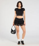 The Flirty Feels Ruffled Lace Mini Skort in black brings edge and energy to your vibe, ready to elevate any festival look or concert outfit.