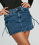 Create bold, fashion-forward looks for spring or summer with the Cool And Confident Cargo Denim Mini Skirt in medium denim wash, a must-have piece from Windsor’s collection of stylish bottoms for women.