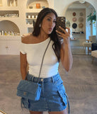 The Cool And Confident Cargo Denim Mini Skirt is a trendy women's bottom in medium denim wash, designed with modern details and alluring textures to complete chic outfits for 2025.