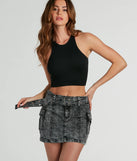 The Trendsetting Aesthetic Belted Denim Mini Skirt is a trendy women's bottom in black, designed with modern details and alluring textures to complete chic outfits for 2025.