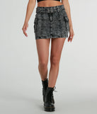 The Trendsetting Aesthetic Belted Denim Mini Skirt is a trendy women's bottom in black, designed with modern details and alluring textures to complete chic outfits for 2025.