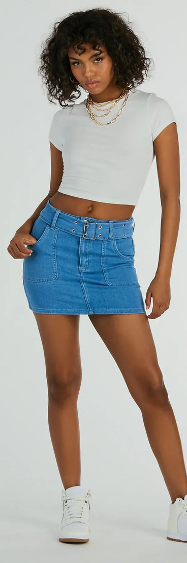 The Trendsetting Look Belted Denim Mini Skirt is a trendy women's bottom in medium denim wash, designed with modern details and alluring textures to complete chic outfits for 2025.