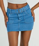 The Trendsetting Look Belted Denim Mini Skirt is a trendy women's bottom in medium denim wash, designed with modern details and alluring textures to complete chic outfits for 2025.