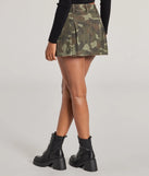 The Adventurous Babe Camo Pleated Cargo Mini Skirt is a trendy women's bottom in olive green, designed with modern details and alluring textures to complete chic outfits for 2025.