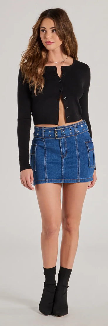 The Cute And Trendy Cargo Mini Skirt is a dark denim cargo skirt, an effortlessly layer-friendly piece ideal for a celebration-ready look with a funtional-inspired flair.