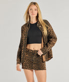 Create bold, fashion-forward looks for summer with the Feeling Fierce Leopard Print Denim Mini Skirt in leopard print, a must-have piece from Windsor’s collection of stylish bottoms for women.