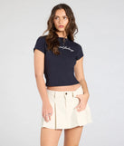 Create bold, fashion-forward looks for spring or summer with the Keep It Cute Pleated Denim Mini Skirt in ivory, a must-have piece from Windsor’s collection of stylish bottoms for women.