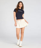 Create bold, fashion-forward looks for spring or summer with the Keep It Cute Pleated Denim Mini Skirt in ivory, a must-have piece from Windsor’s collection of stylish bottoms for women.
