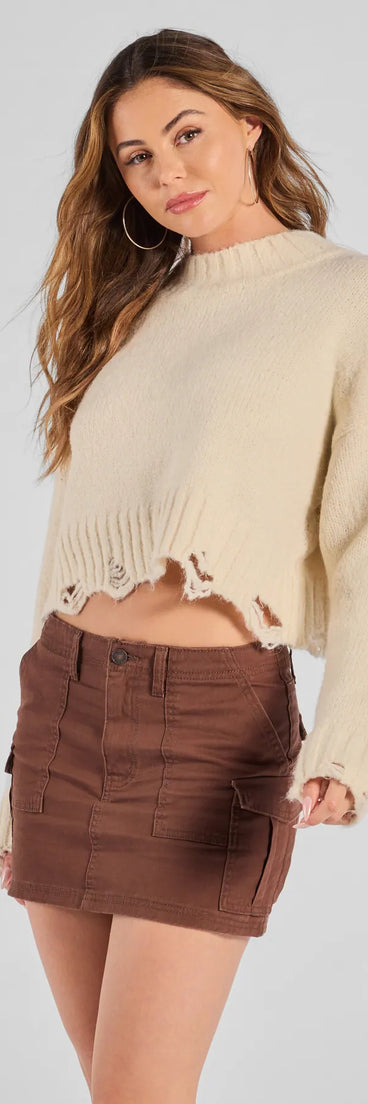 The Casually Cool Mid-Rise Cargo Mini Skirt is a trendy women's bottom in brown, designed with modern details and alluring textures to complete chic outfits for 2025.