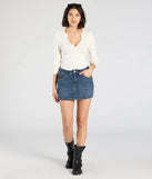 The Tell Me About It Stud Mid Rise Denim Mini Skirt in dark denim wash brings edge and energy to your vibe, ready to elevate any festival look or concert outfit.