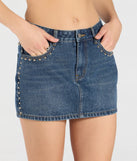 With a flattering fit and cool-girl edge, the Tell Me About It Stud Mid Rise Denim Mini Skirt in dark denim wash is the perfect denim skirt to dress up or down for all your summer plans.