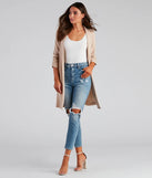 The High-Rise Distressed Mom Skinny Jeans is a trendy women's bottom in medium denim wash, designed with modern details and alluring textures to complete chic outfits for 2025.